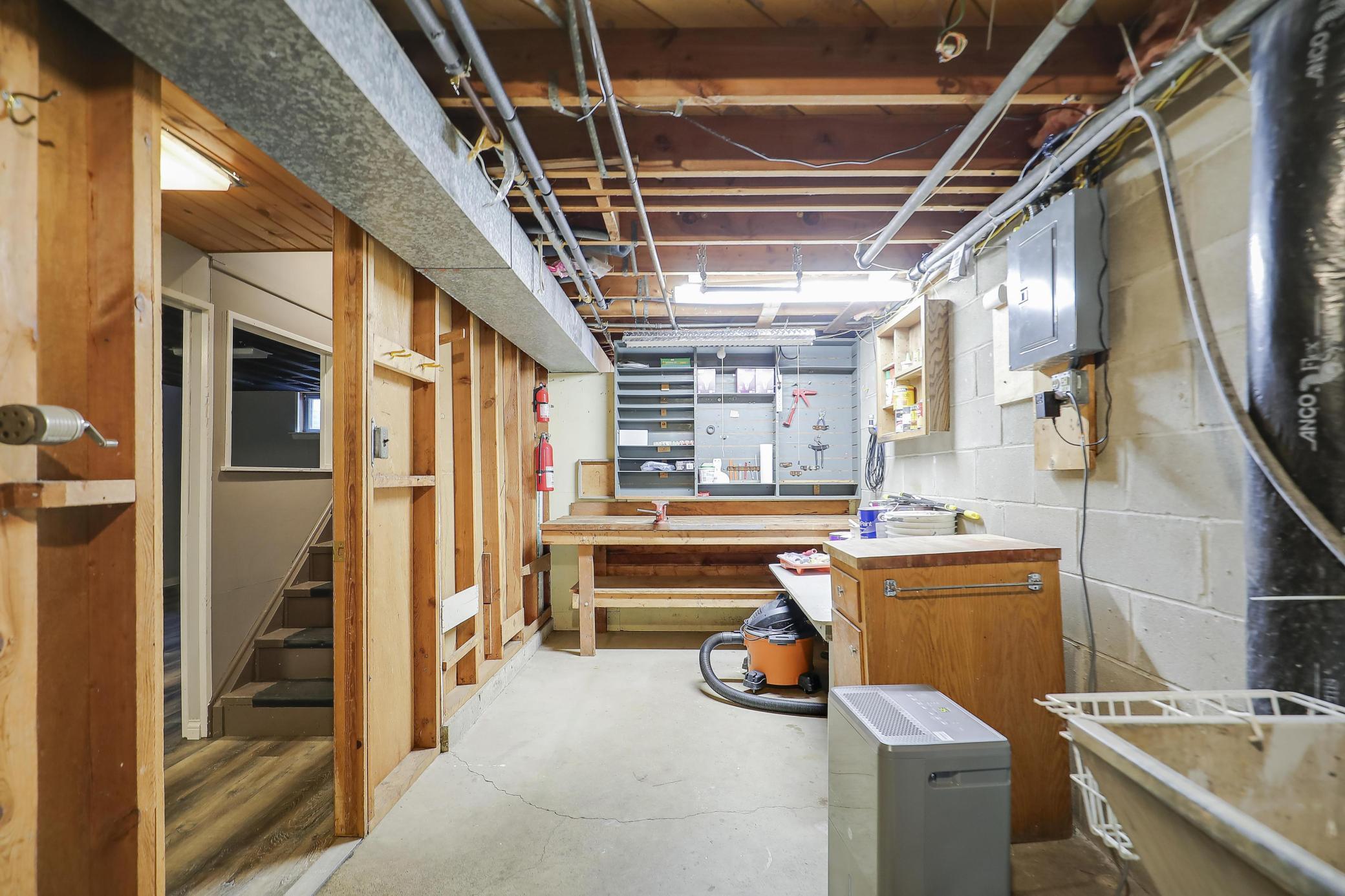 Great workshop in the mechanical room with laundry and a sink!