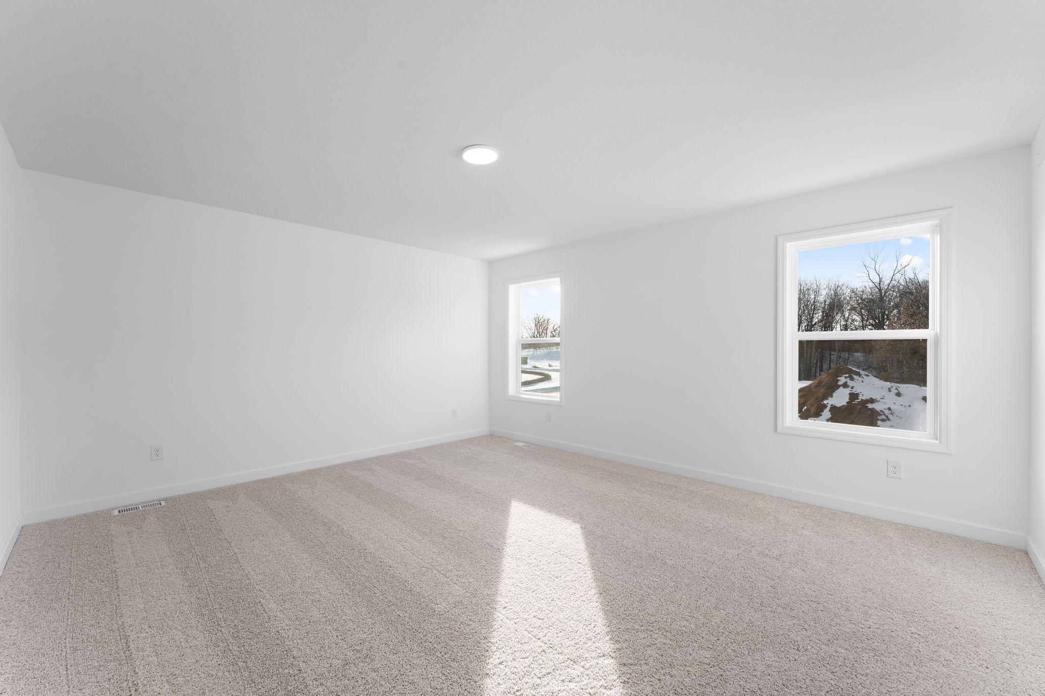 (Photo of a similar home, actual finishes may vary) The owner’s suite is located on the home’s second level, complemented by a spa-like bathroom and walk-in closet.