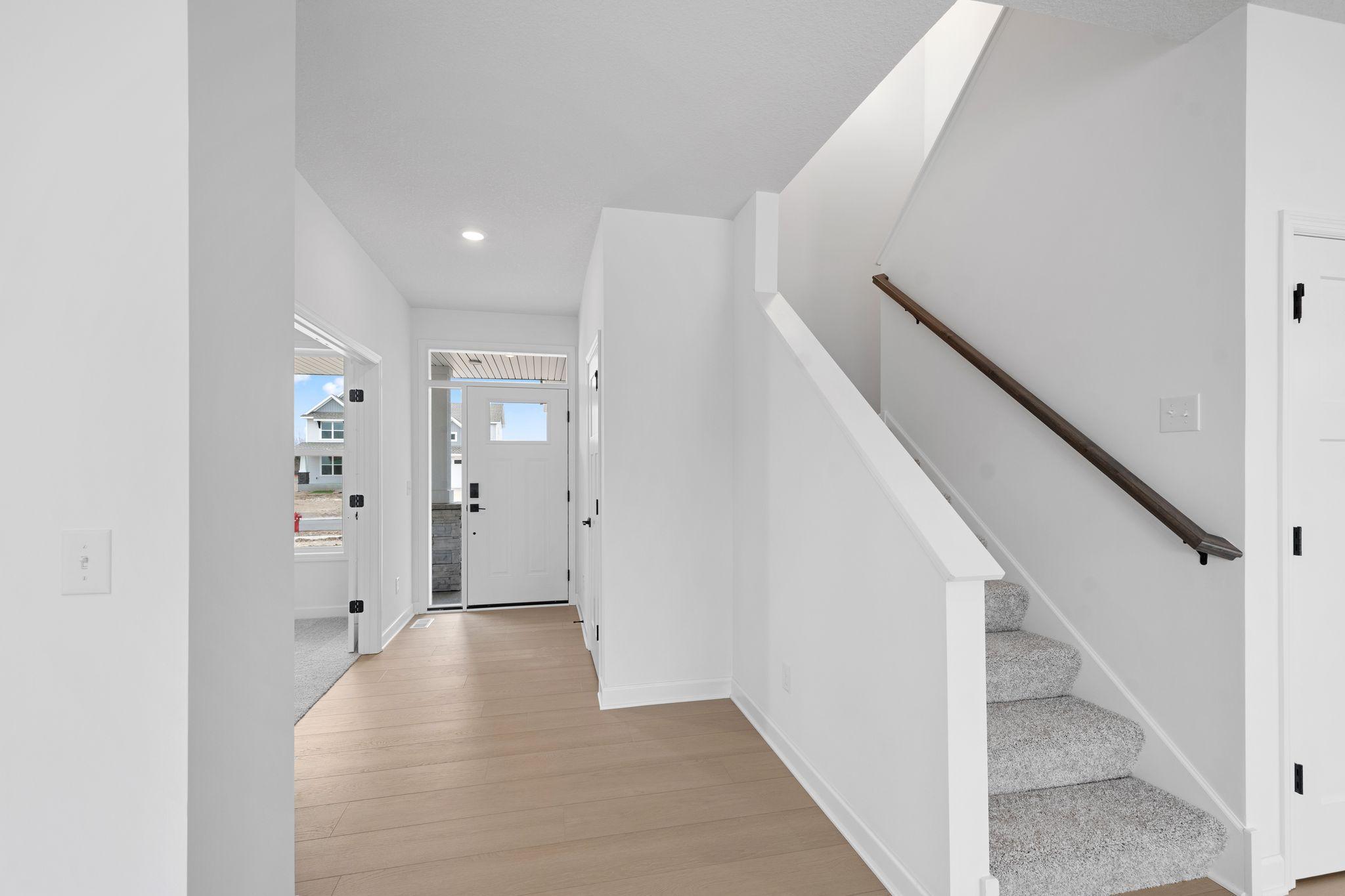 (Photo of a similar home, actual finishes may vary) Ease of access from the foyer to all shared living spaces