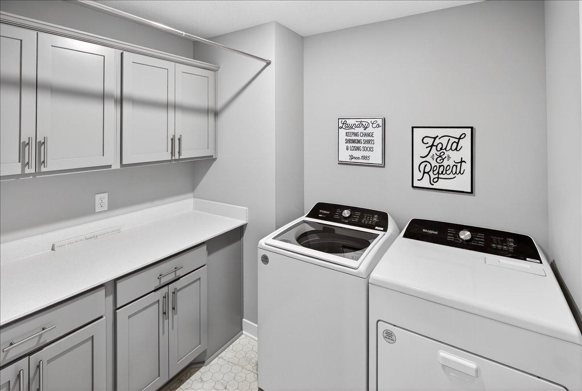 Laundry room with storage and hanging space