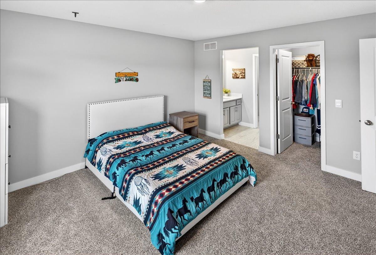 Bedroom 2 with large walk-in closet and bath
