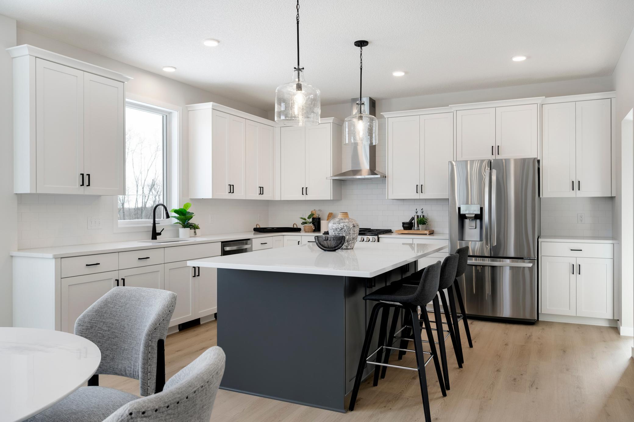 New Robert Thomas Home Now finished! 5 bedrooms & 3-car garage. Quick Move in home, Available now, move right in! Enjoy cooking & entertaining in this beautiful super-sized kitchen! and Custom Cabinets with soft close doors and drawers, throughout!