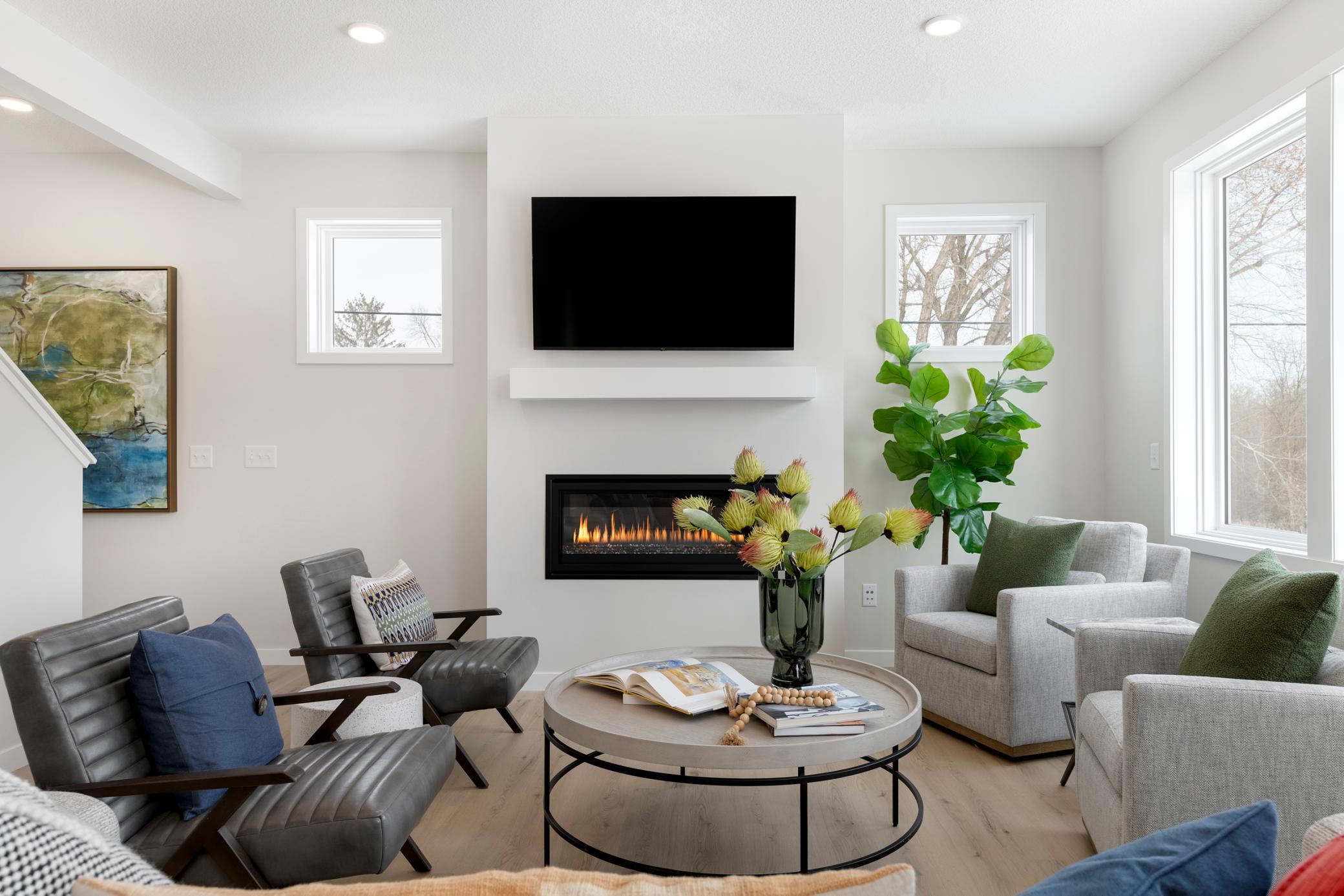 Large Gathering room with wall of windows, and cozy gas fireplace!