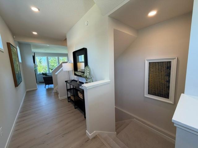 Main floor entrance with abundance of windows! and beautiful turned staircase to 2nd floor 4 bedrooms and loft; or to finished lower level with family room 5th bedroom and bath.