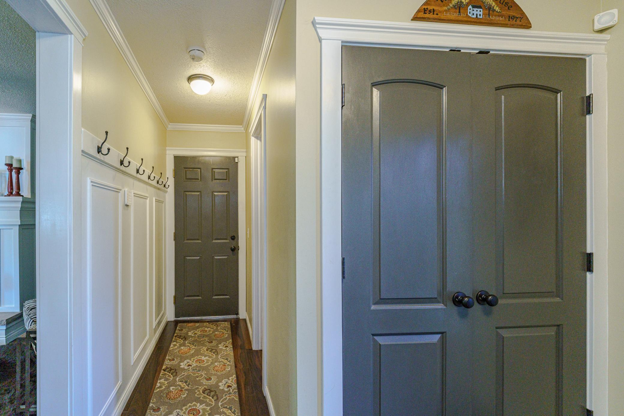 Back hall to the garage and half bath.