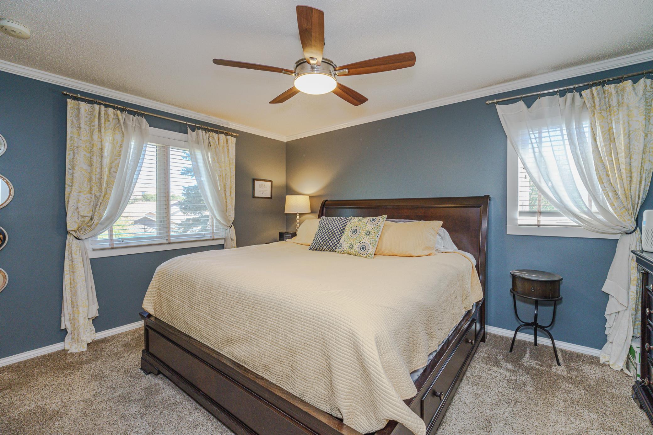 The owner’s suite is generously-sized and includes crown molding and a walk-in closet.