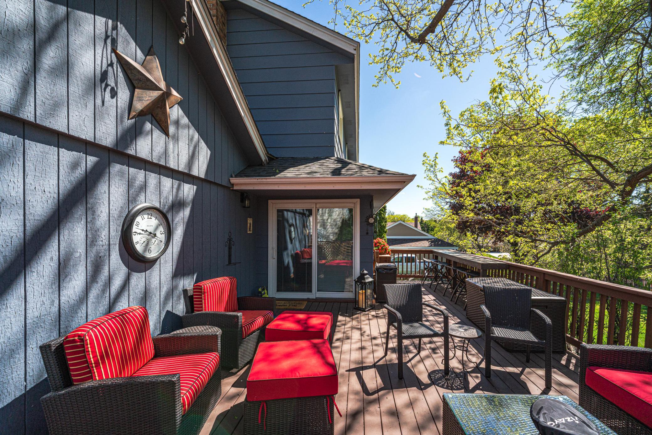 This deck lies off the family room, and it has lots of space for your seating arrangements, as well as a high top serving bar (along rail to the right.)
