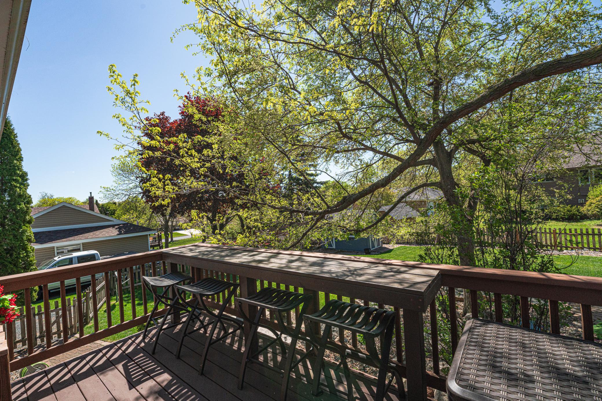 This seating bar overlooking the backyard also works well for serving.