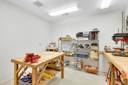 Finished workshop area with ventilation fan and plentiful, raised, 20 amp Sockets.