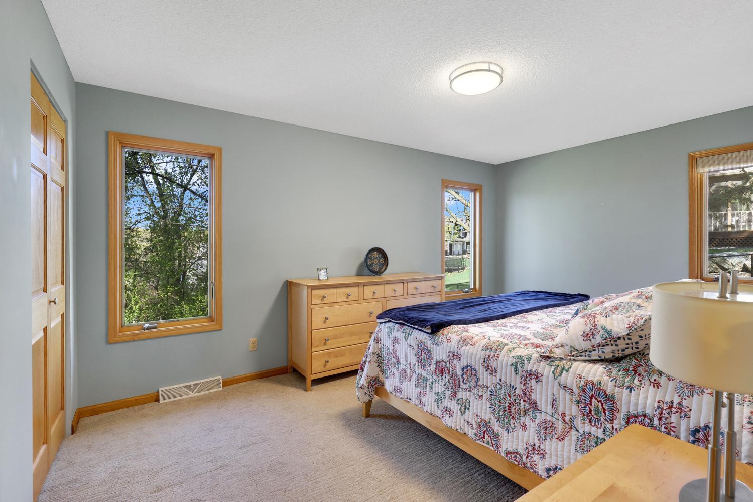 Primary bedrooms have windows with elevated views.
