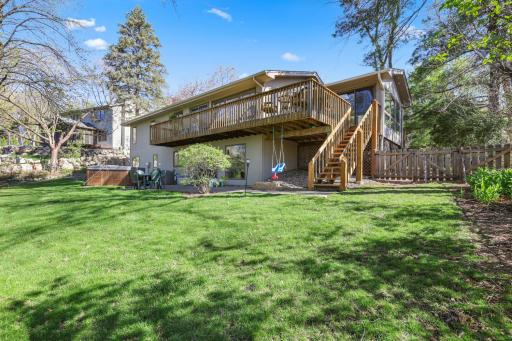 Huge deck with steps to lower patio area.