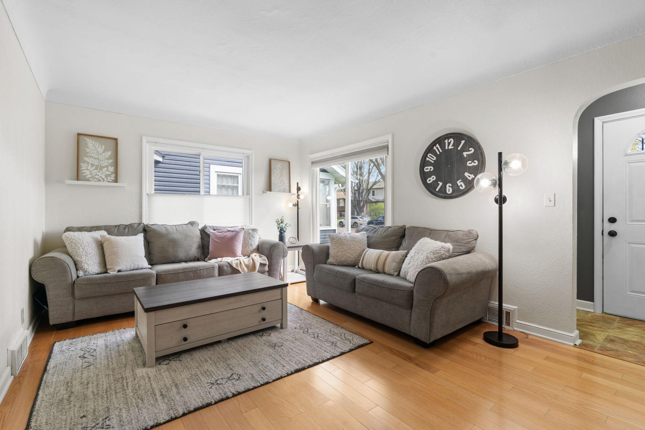 Large, updated windows flood the room with natural light.