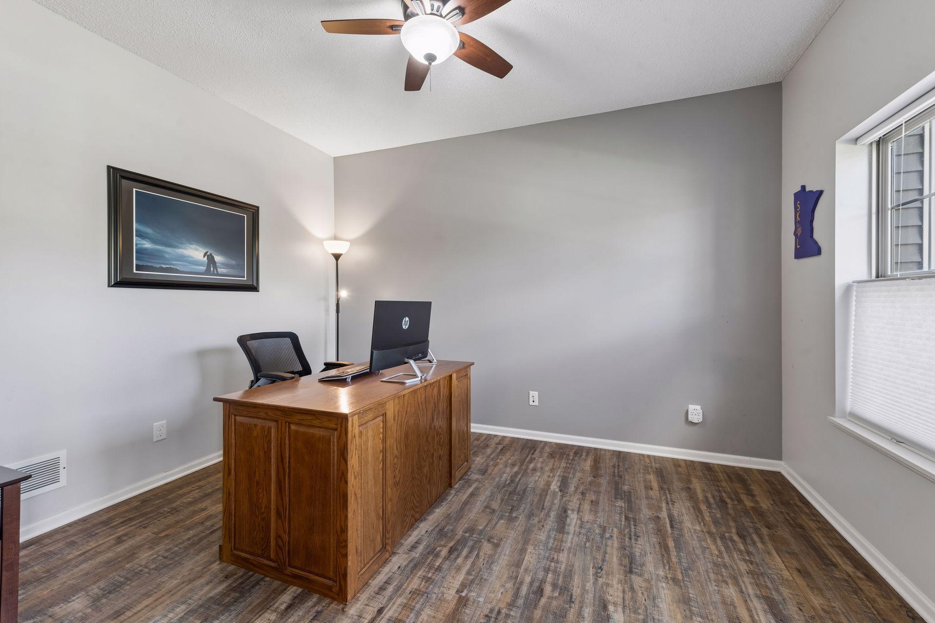 The windows look out to the front of the home which is nice to see deliveries or guests arriving. French doors provide privacy for calls.