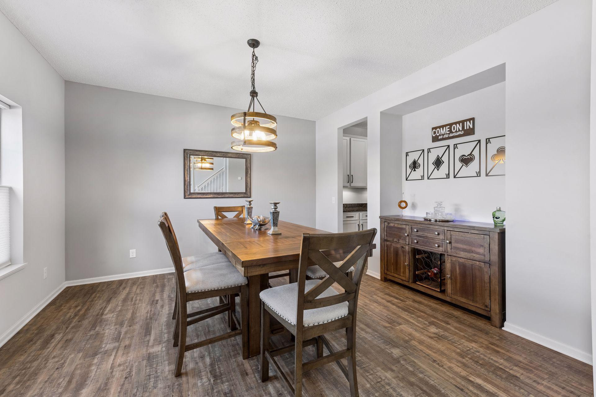 At the front of the home is a formal dining room with a niche for a credenza and the butlers pantry off to the corner.