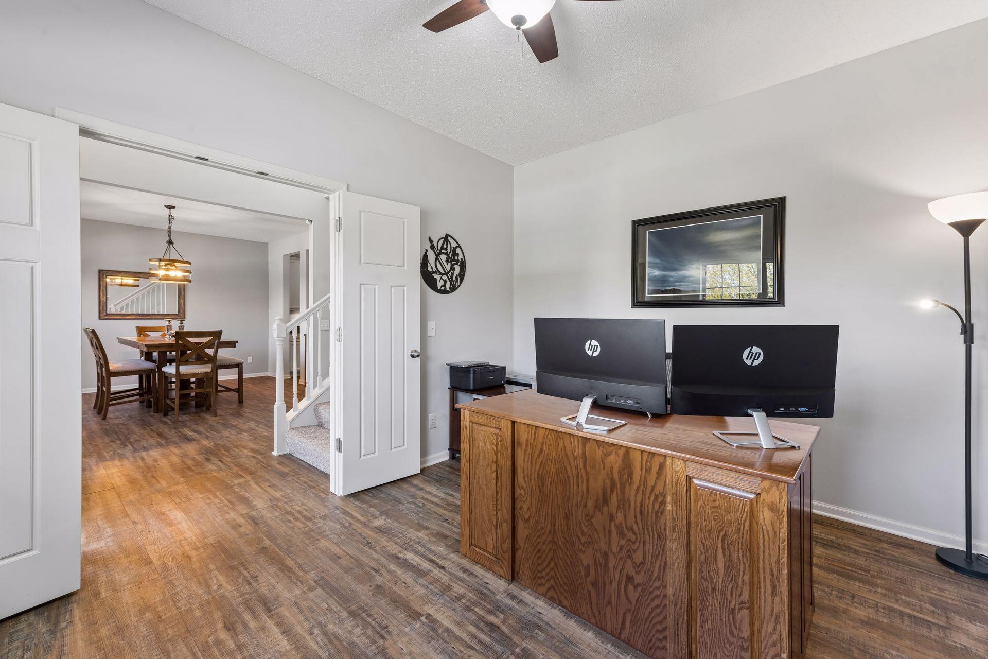 The home has practical plank style LVT flooring and 9-ft ceilings throughout the main floor. At the front of the home is an office and dining/flex room.