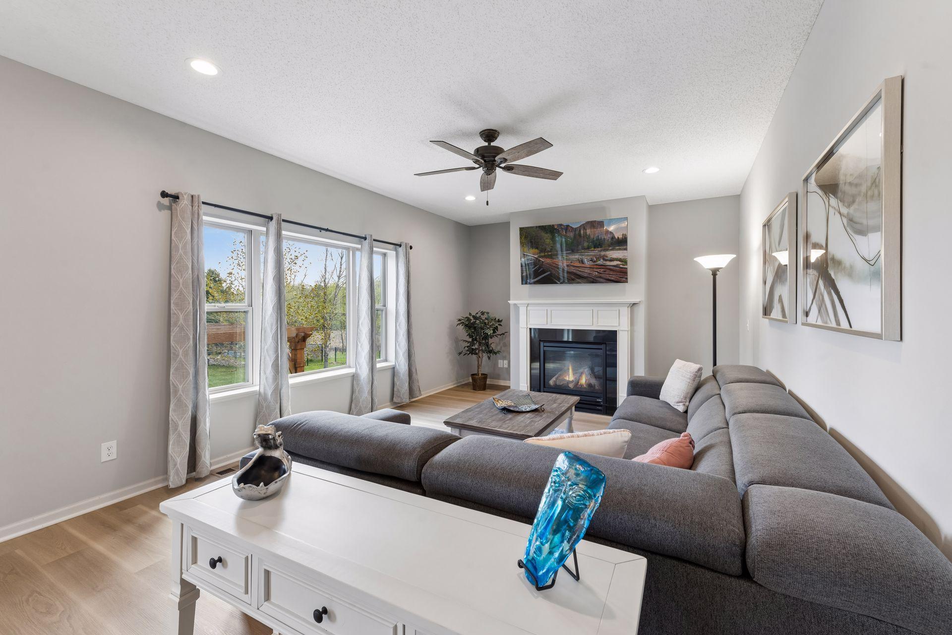 The fireplace with gas logs is the focal point of the living room.