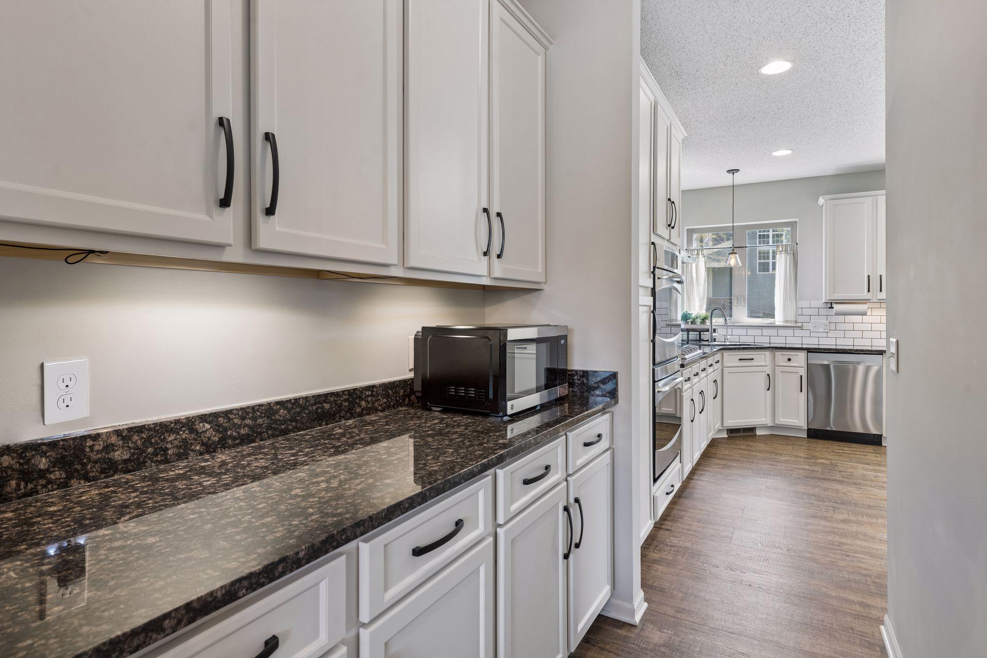 Off the kitchen is a convenient butlers pantry for additional storage and prep space.