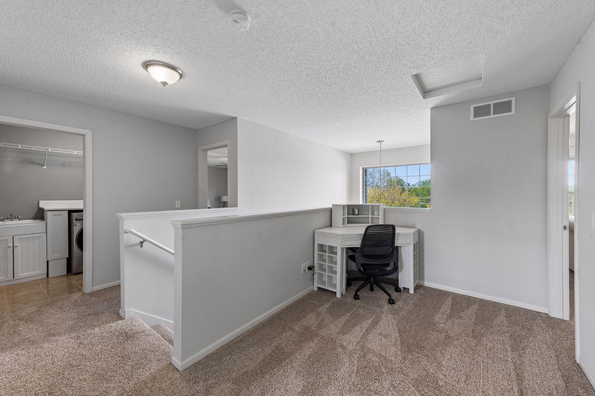 At the top of the stairs is a small loft that is perfect for a desk, reading nook or TV area.