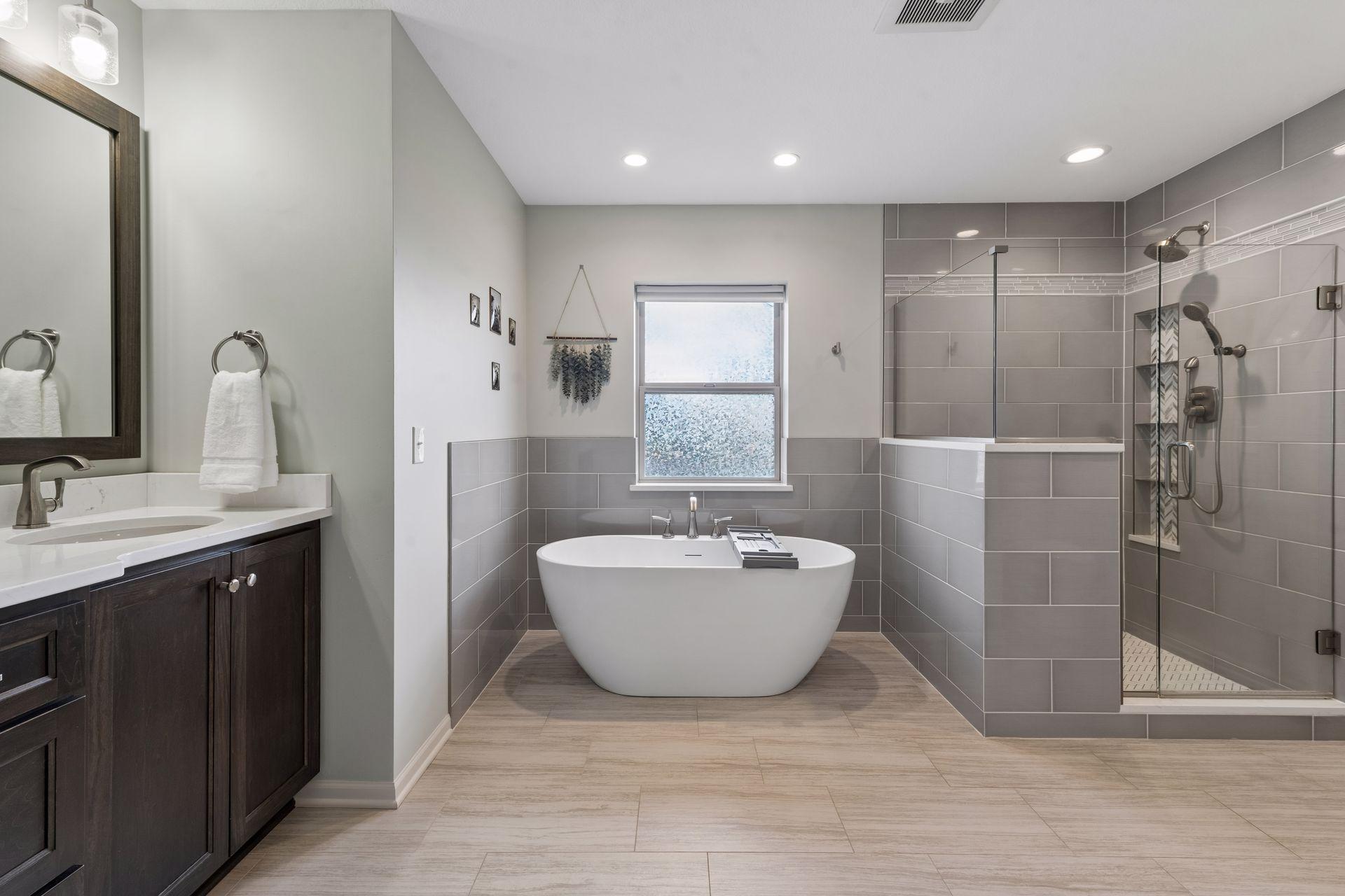 There is a free standing tub and separate custom tile shower.