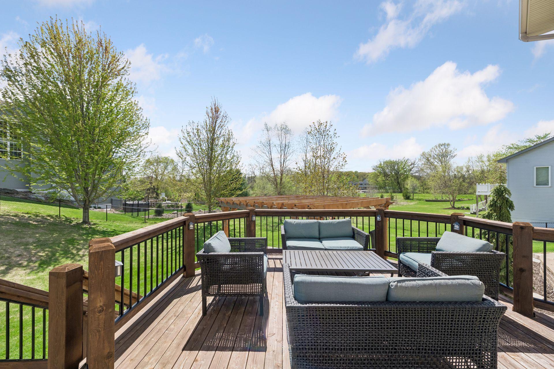 Off the informal dining area is a deck with stairs down to the large patio.