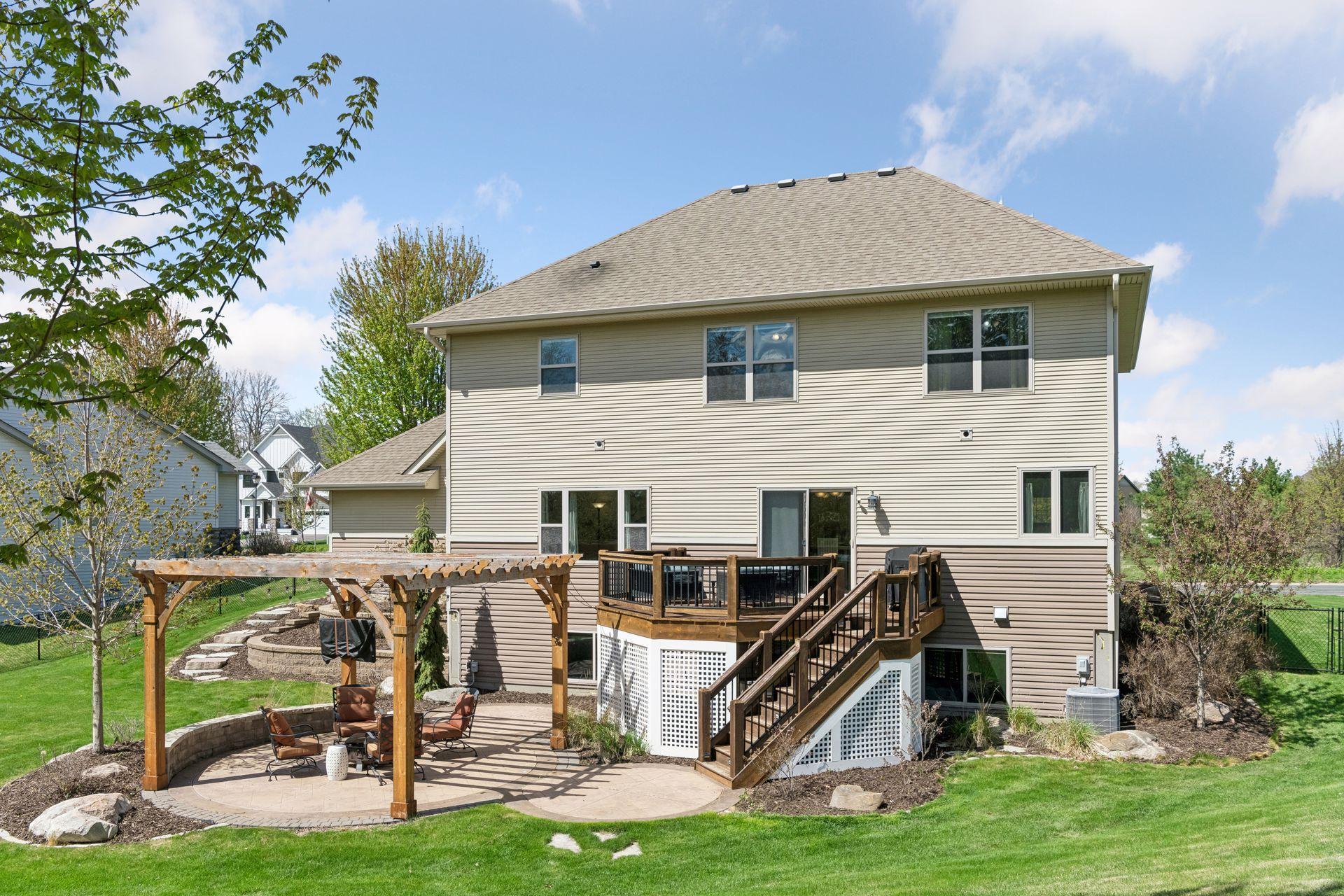 The home has a wonderfully landscaped backyard. Here you can see the stamped concrete patio and landscape beds.