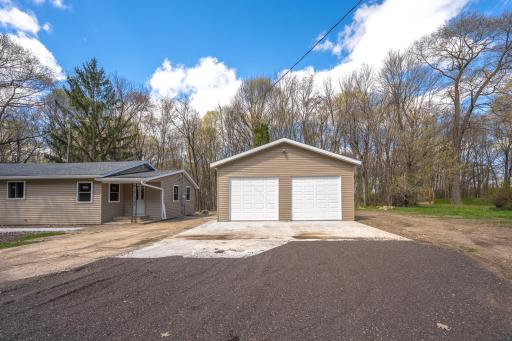 Brand new two car garage and fresh poured concrete apron