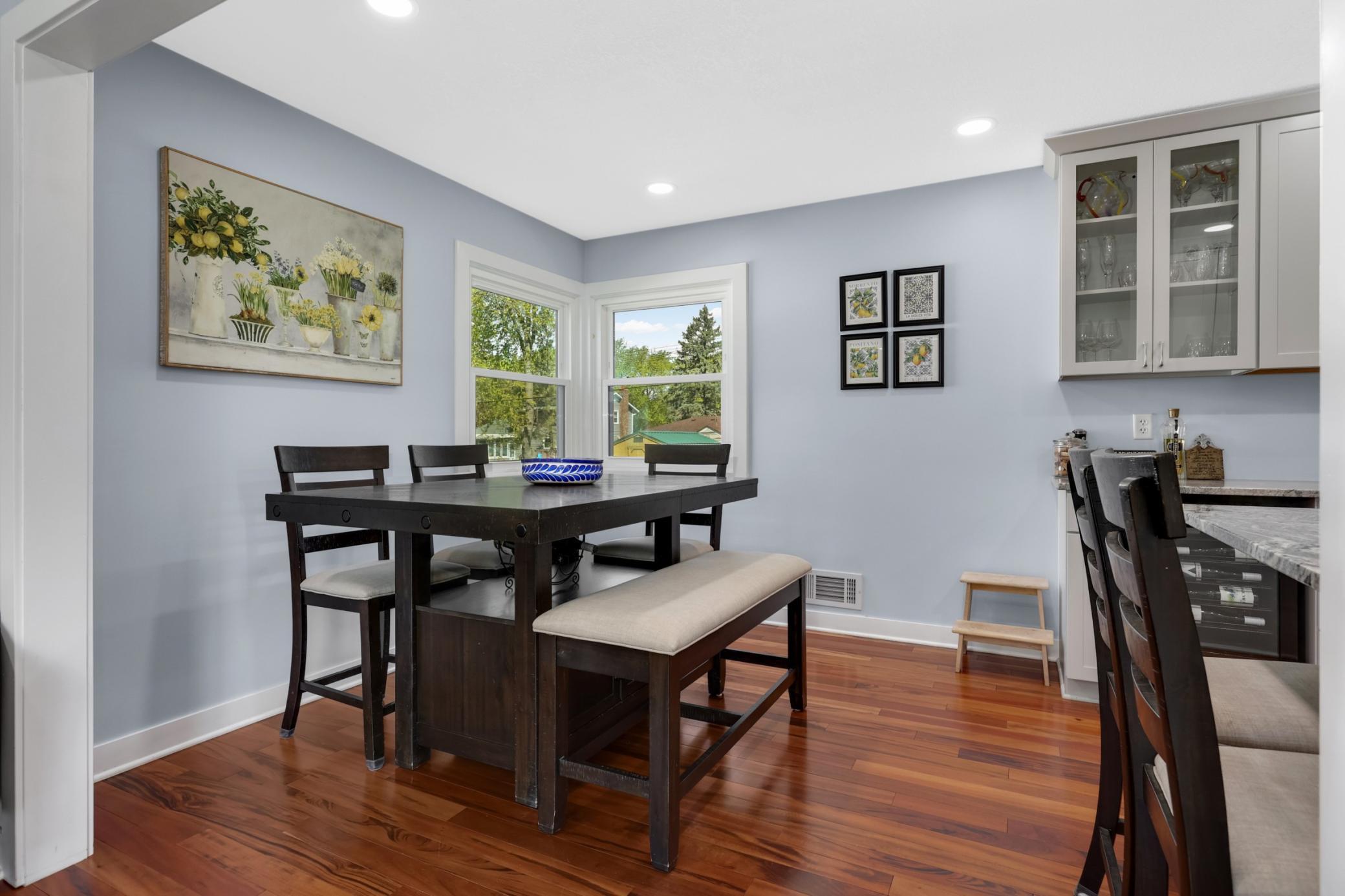 The informal dining room has space for six, with room at the breakfast bar for two more!