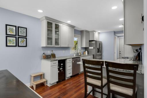 With modern day conveniences like the stainless steel dishwasher and wine fridge, hosting is a breeze in this space.