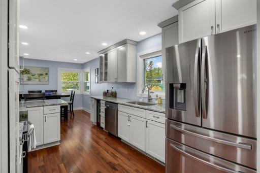 The kitchen window overlooks the backyard for a great view of your exterior space.