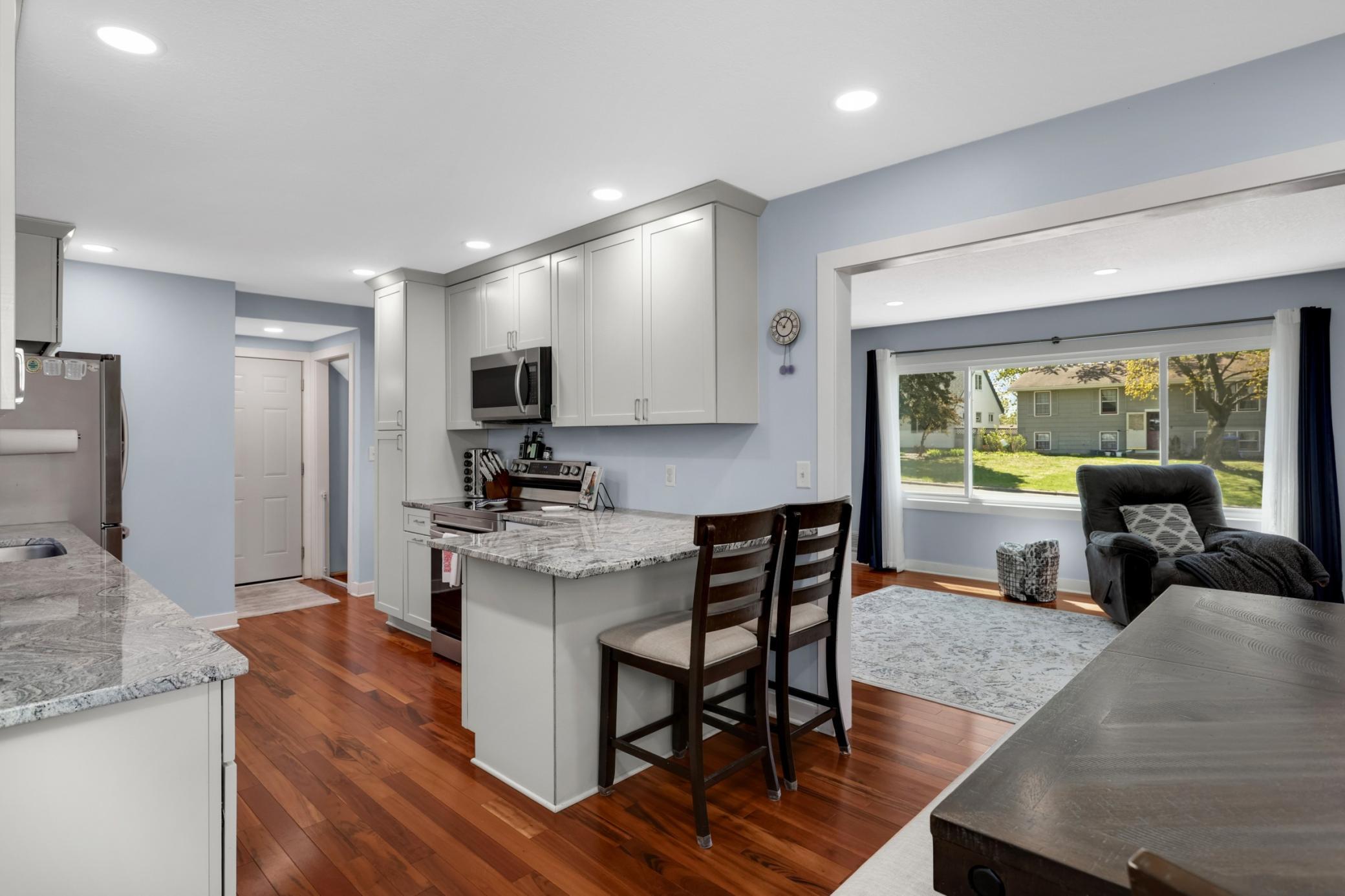 The 2022 kitchen remodel is calling you with it's granite countertops, new cupboards, stainless steel appliances and a wine fridge. Oh, the things you could cook in this space!
