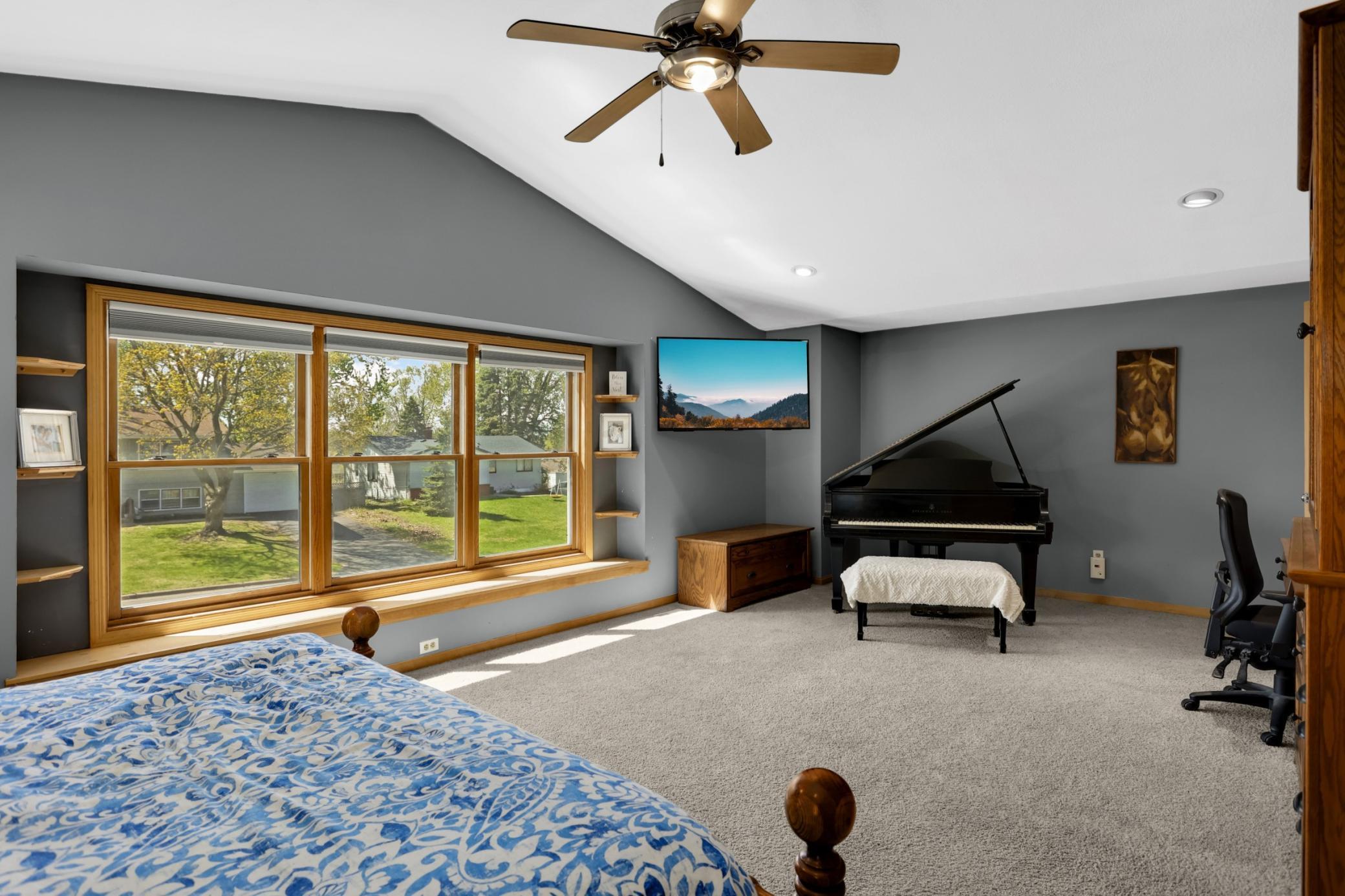 The vaulted ceiling, ceiling fan and window seat helps solidify this is the best room in the house!