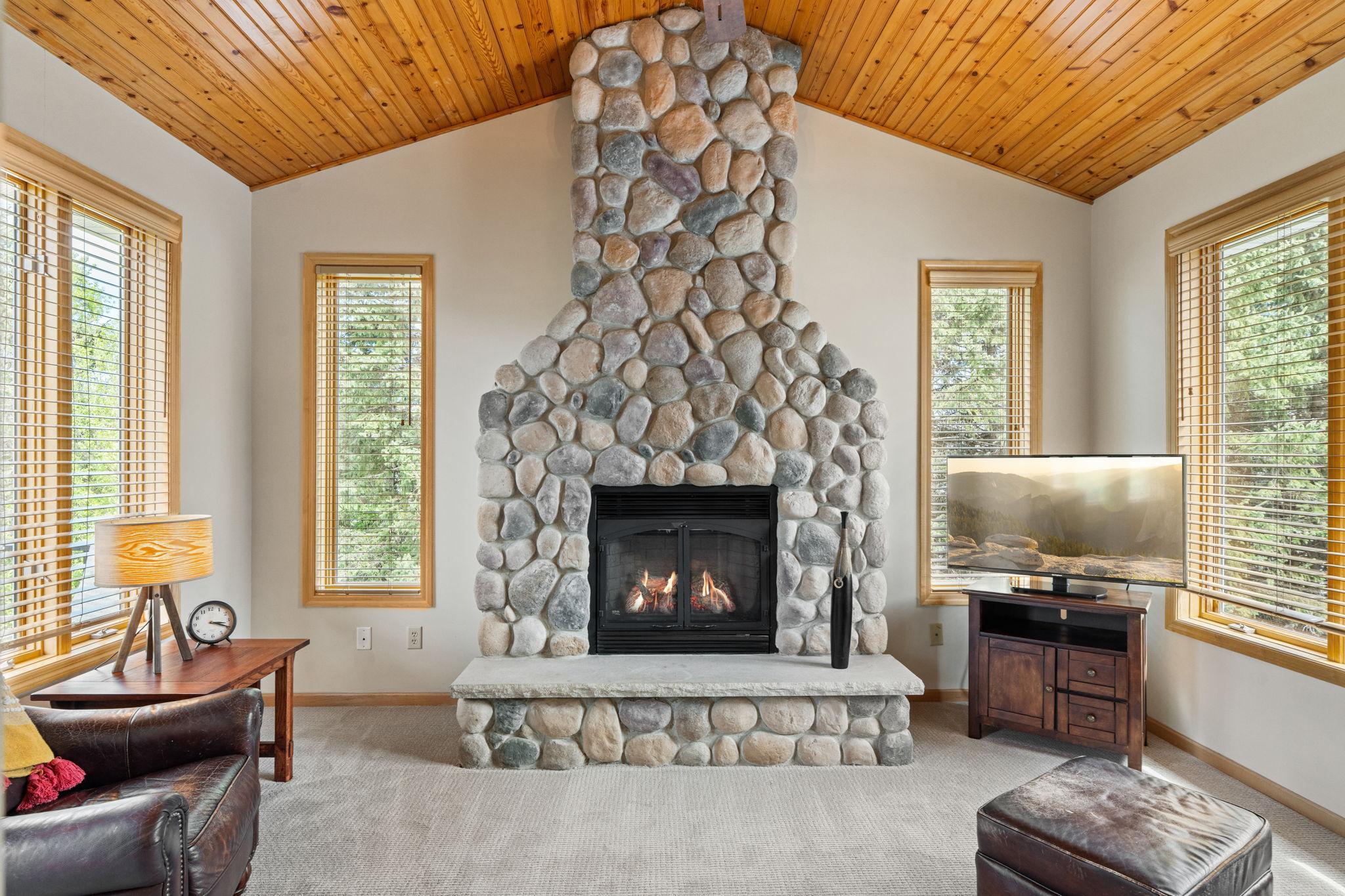 Floor To Ceiling Stone Fireplace