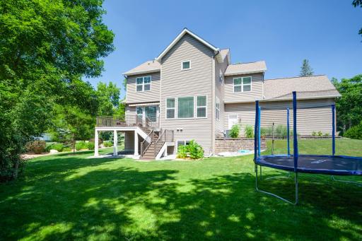 Flat, open green space is ideal for backyard games and pets. As an added bonus, it is surrounded by incredible landscaped gardens lending both privacy and beauty to the yard.