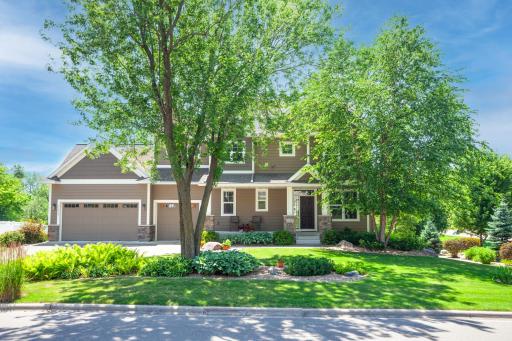 Set on a beautifully landscaped half-acre corner lot, this impressive home offers exceptional curb appeal with a welcoming front porch, oversized 3-car garage, mature trees & thoughtfully designed landscaping that creates a serene, park-like setting.
