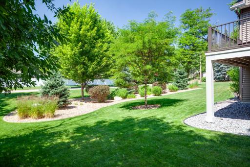 Gorgeous perennial gardens and professionally landscaped surroundings throughout the huge, half acre homesite.
