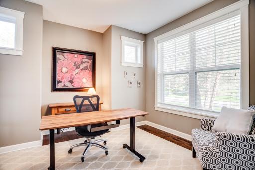 Flooded with natural light, this versatile office space features hardwood floors and windows or glass along all four walls!