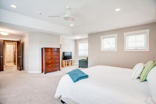 The separate sitting area is a cozy niche perfect for reading or private media time.