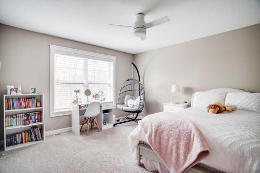 The private upper level offers three spacious bedrooms, two full baths, and a beautifully appointed laundry room.