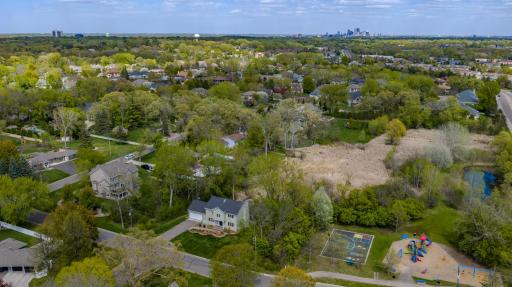 Aerial view showing the home on the left, and how conveniently close Mayflower Park is. This home perfectly combines the tranquility of a private retreat, all while remaining just minutes from everyday conveniences.