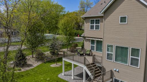 A great overhead view of the spacious, maintenance free deck which steps down to the backyard and is accessed via the dining room for easy outdoor dining and grilling.