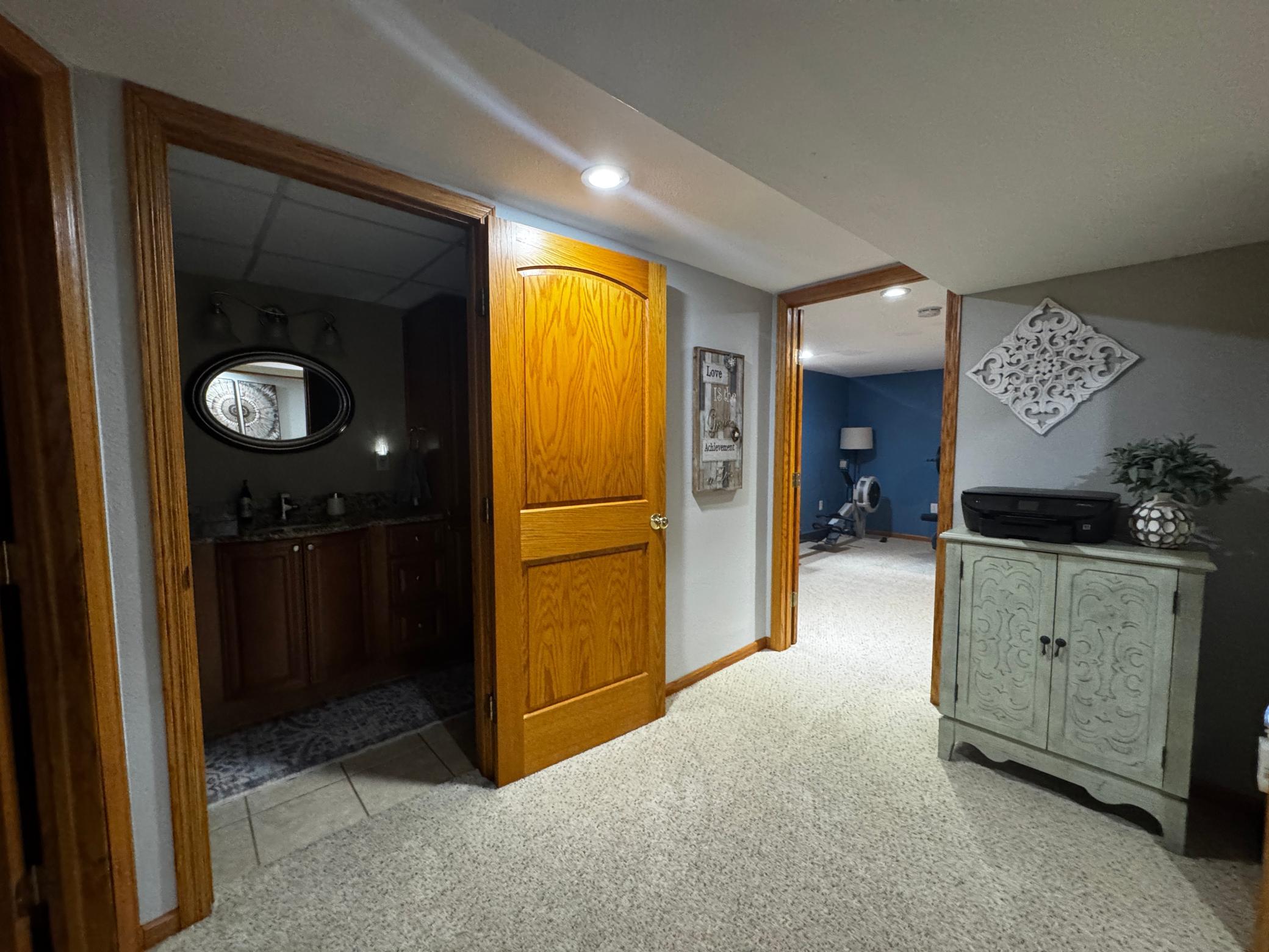 Lower level landing, 2 bedrooms, family/bonus room, full bathroom and laundry.
