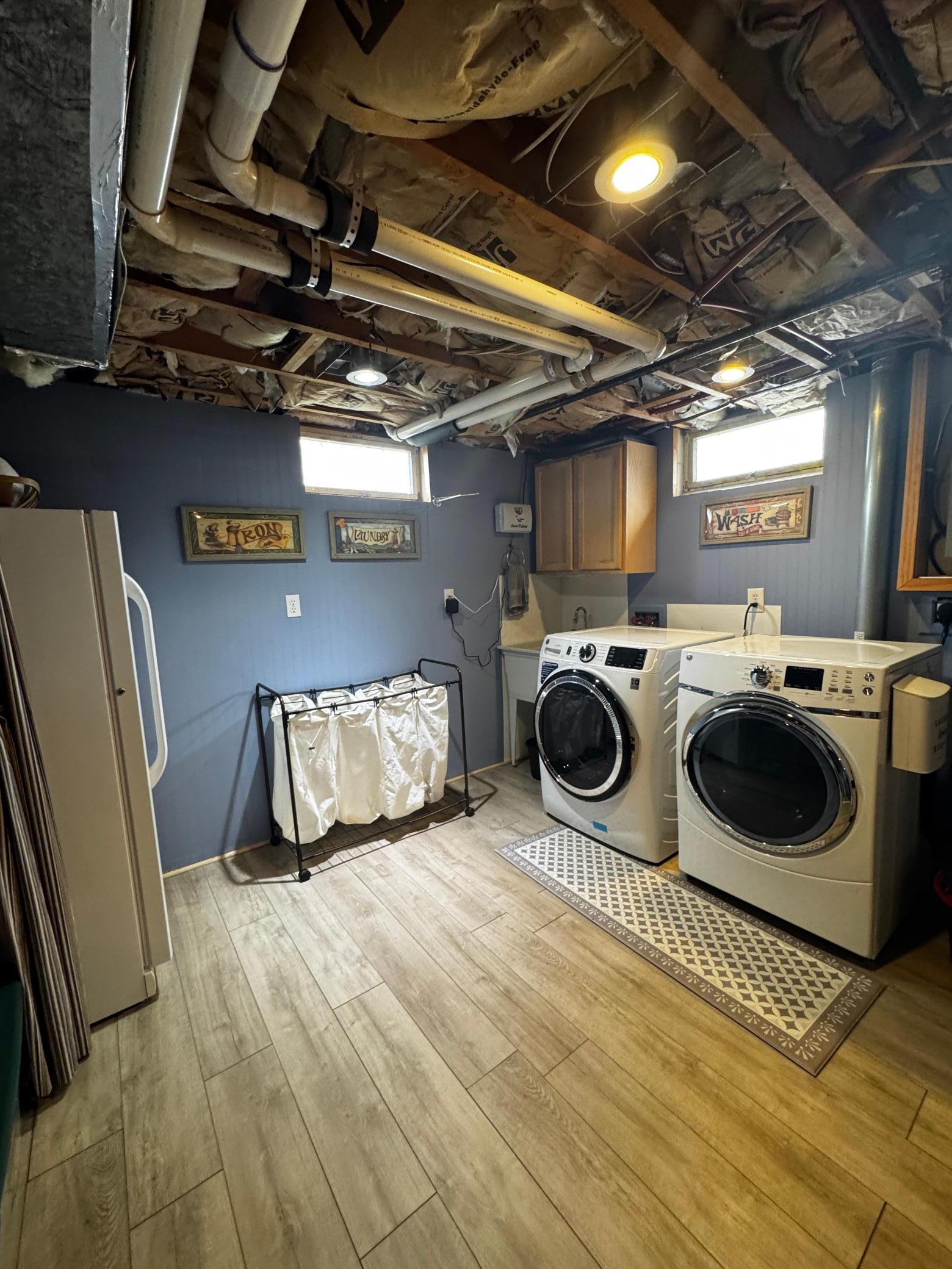 Laundry and utility room with abundant storage.
