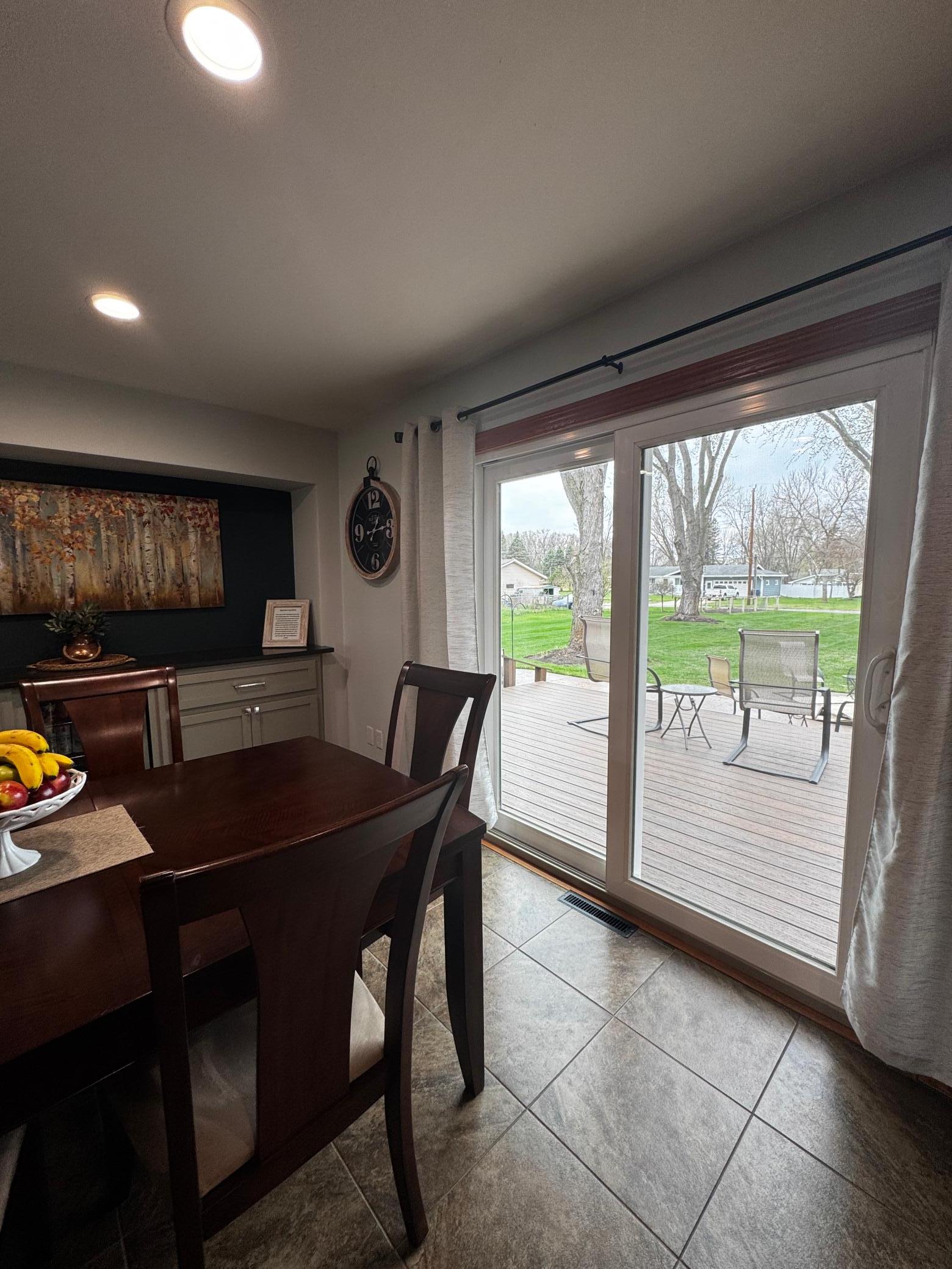 Patio door access to deck and backyard.