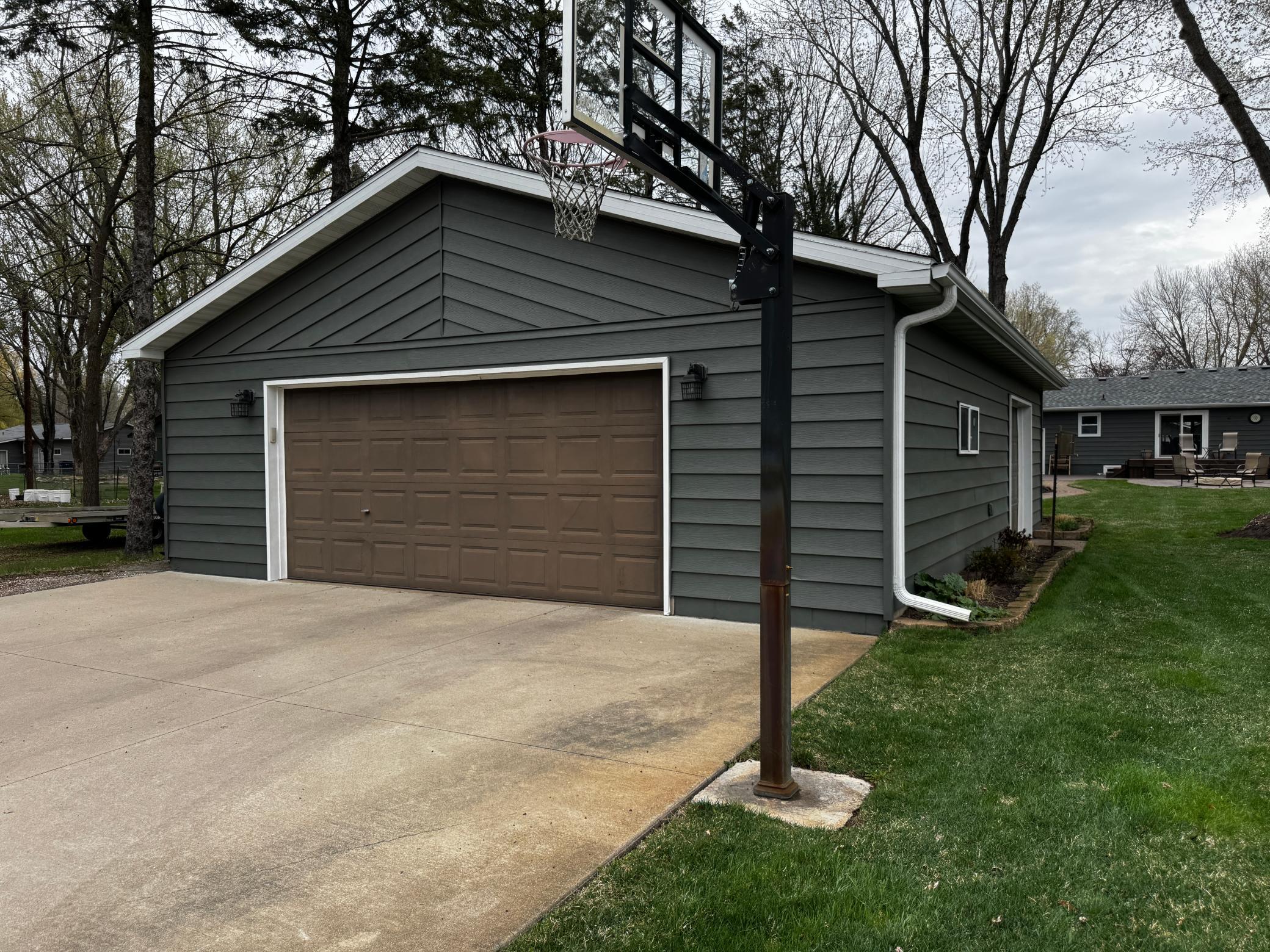 30X40 detached heated garage, triple door with work bench and shelving storage.