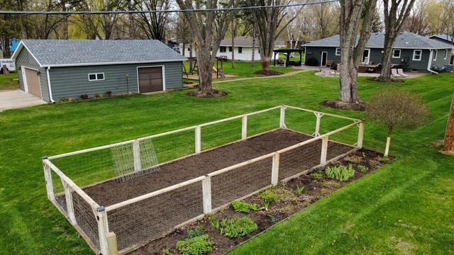 View of back yard with garden and easycare perennials.