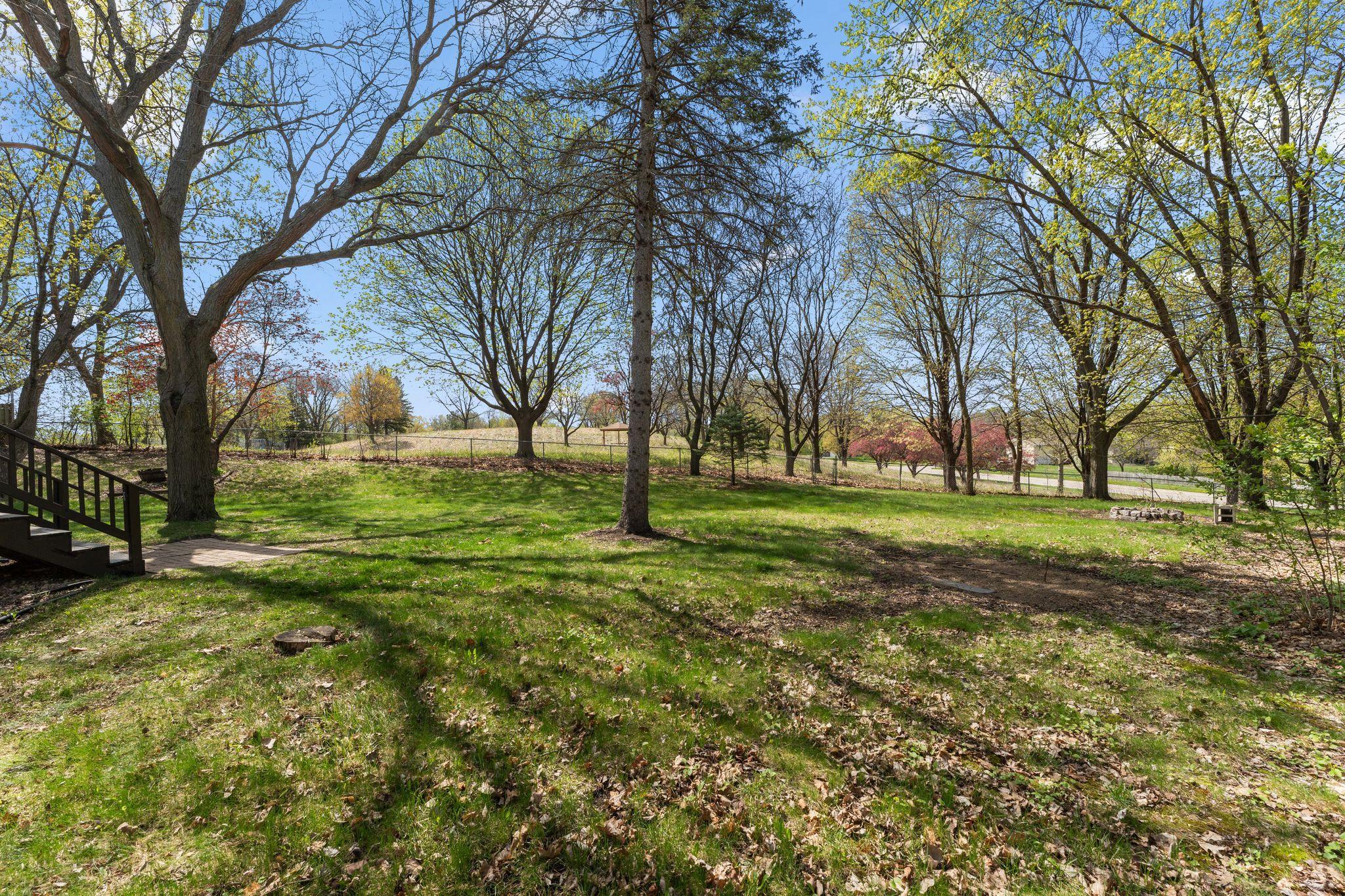 Large fully fenced yard that backs up to park and green space!