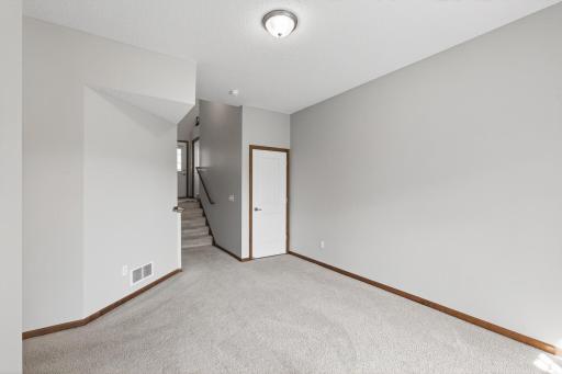 Basement with Storage Space Under Stairs
