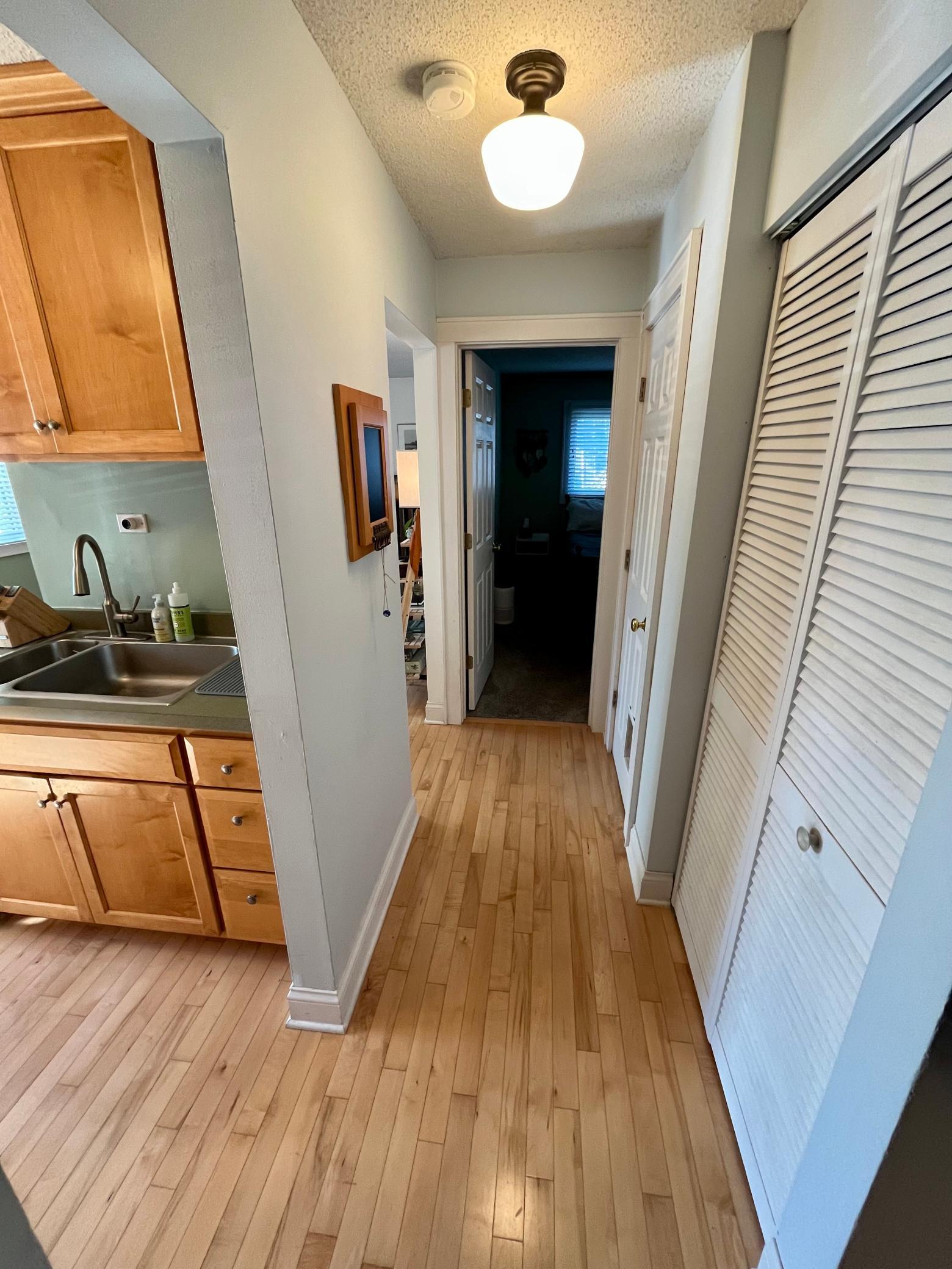 Hallway with closets, to the bedroom