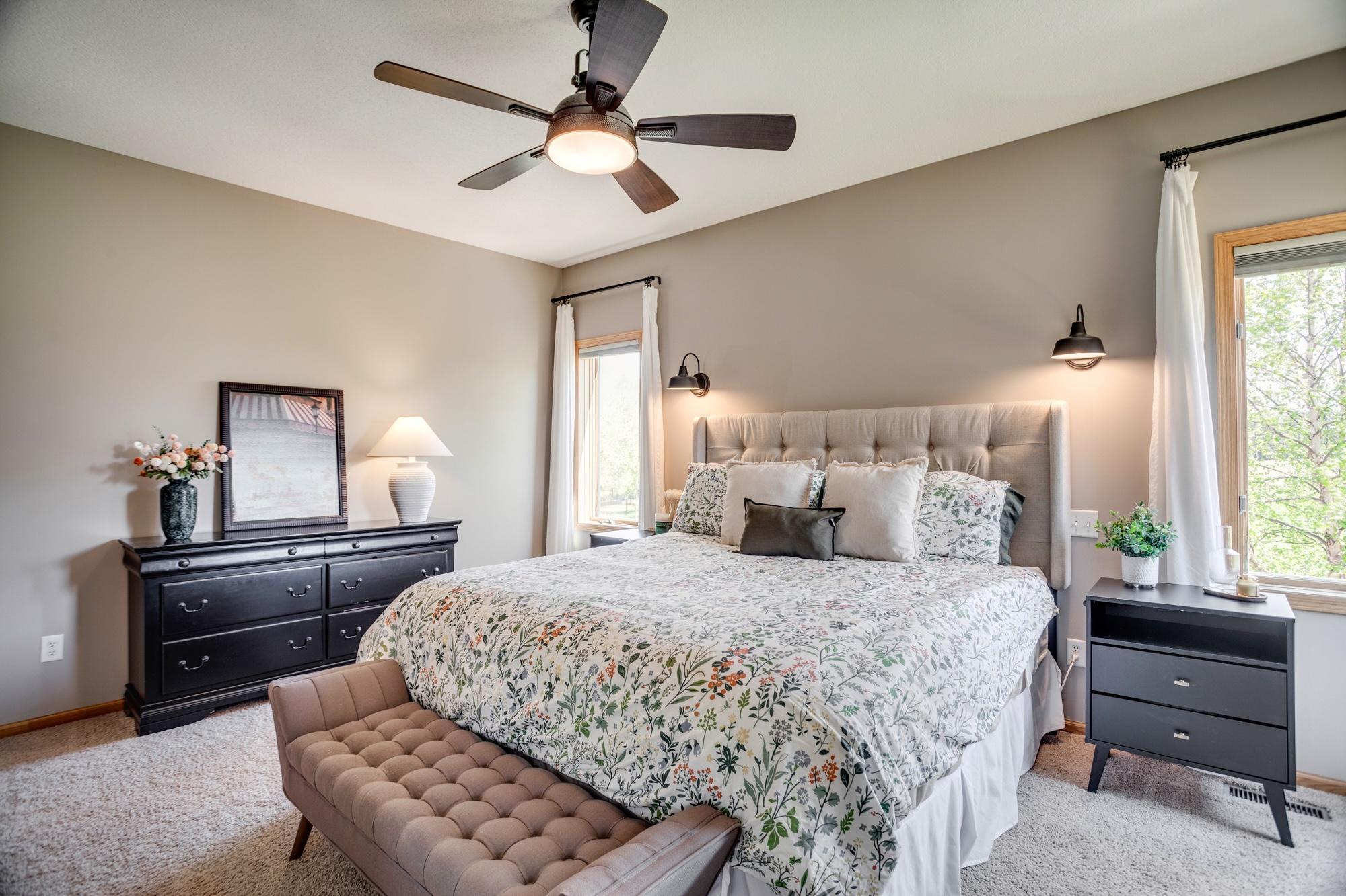 Main-level owner’s suite with private bathroom, walk-in shower and walk-in closet