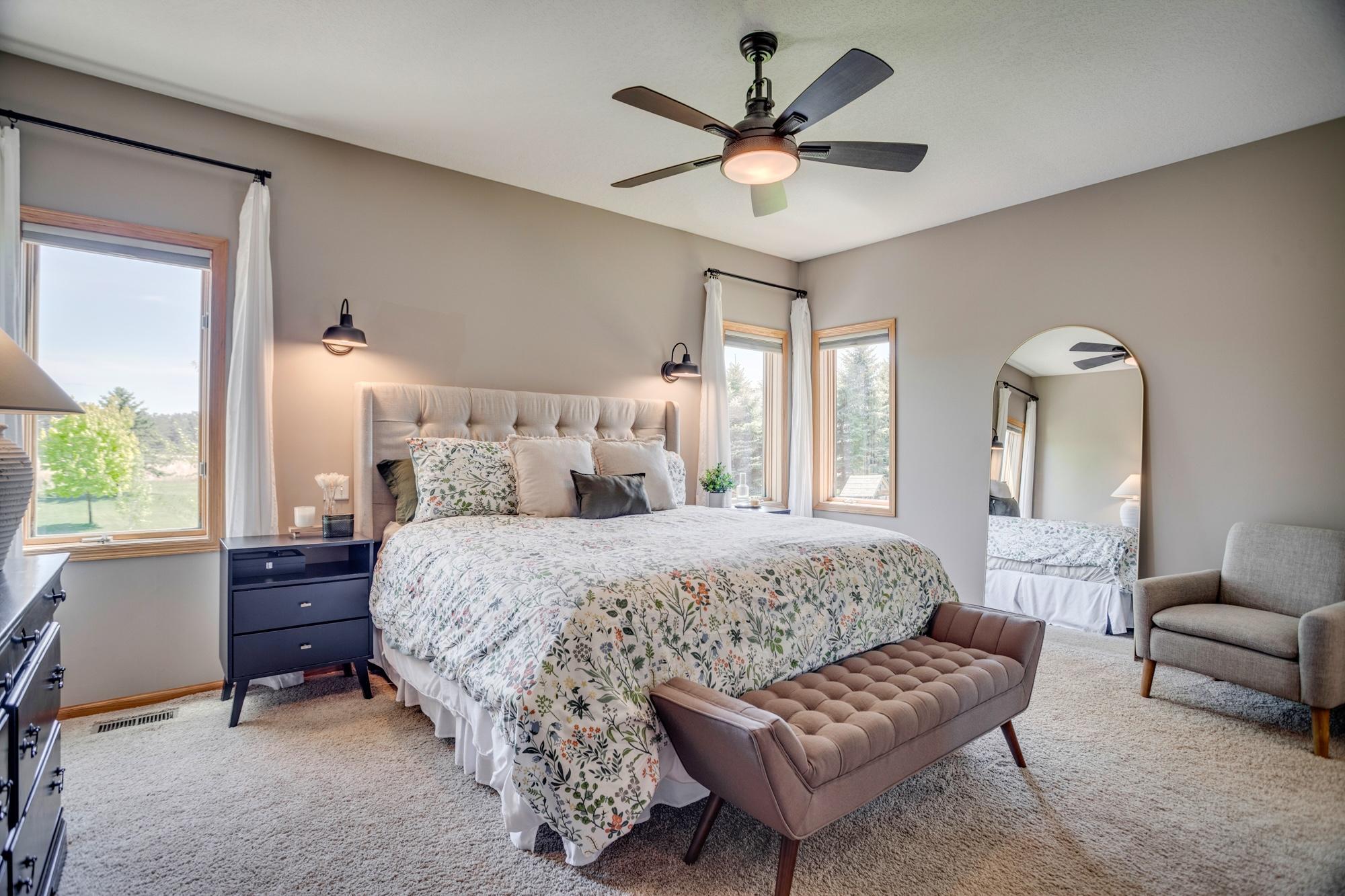 Main-level owner’s suite with private bathroom, walk-in shower and walk-in closet